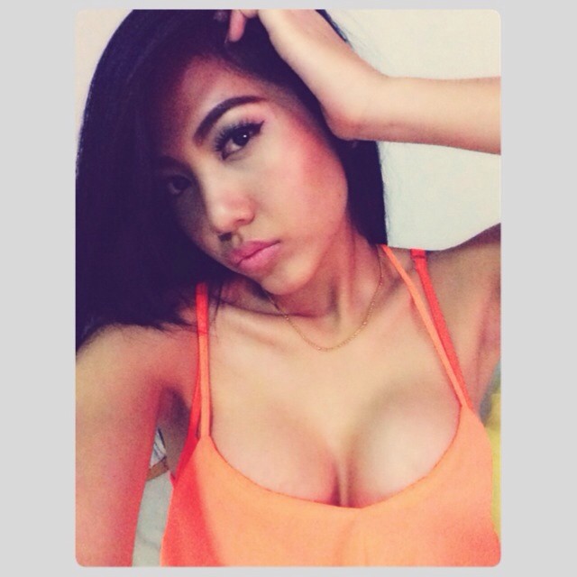mikie-k-in-lowcut-orange-top